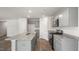 Modern kitchen with gray cabinets, granite countertops, and stainless steel appliances at 236 Holton St, Smithfield, NC 27577