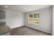 Open kitchen with gray cabinets, granite countertops, and access to patio at 236 Holton St, Smithfield, NC 27577