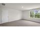 Spacious bedroom with carpeted floor and large window at 236 Holton St, Smithfield, NC 27577