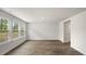 Bright living room with wood-look floors and access to backyard at 236 Holton St, Smithfield, NC 27577