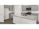 Modern kitchen island with gray cabinets and granite countertops at 236 Holton St, Smithfield, NC 27577