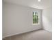 Bright bedroom with carpeted floor and window at 236 Holton St, Smithfield, NC 27577