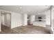 Open living space with wood-look flooring and access to kitchen and patio at 236 Holton St, Smithfield, NC 27577