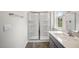 Bathroom with shower, vanity, and grey cabinets at 236 Holton St, Smithfield, NC 27577