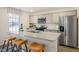 Modern kitchen with granite countertops, stainless steel appliances, and an island at 241 Holton St, Smithfield, NC 27577