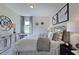 Spacious bedroom with large window, neutral decor, and ample space at 904 Delano Dr, Knightdale, NC 27545