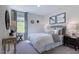 Bright bedroom with large window, neutral decor, and ample space at 904 Delano Dr, Knightdale, NC 27545