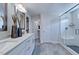 Elegant bathroom with double vanity, large shower, and modern fixtures at 904 Delano Dr, Knightdale, NC 27545