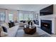 Comfortable living room with fireplace and large windows at 904 Delano Dr, Knightdale, NC 27545