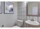 Chic powder room with stylish wallpaper and modern vanity at 904 Delano Dr, Knightdale, NC 27545