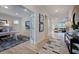 Bright home office features hardwood floors, built-in shelving, and view into living area at 904 Delano Dr, Knightdale, NC 27545