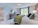 Bright bedroom with double windows and plush bedding at 904 Delano Dr, Knightdale, NC 27545