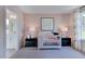 Adorable Bedroom with a crib, calming decor, and a view of the bathroom at 904 Delano Dr, Knightdale, NC 27545