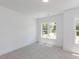 Bright bedroom with plush carpeting and large window offering natural light at 103 Brandy Ml, Pittsboro, NC 27312