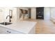 Modern kitchen island with white cabinets and a farmhouse sink at 103 Brandy Ml, Pittsboro, NC 27312