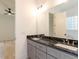 Bathroom with double vanity, marble countertops, and view of bedroom at 103 Brandy Ml, Pittsboro, NC 27312