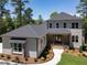 Two-story house with gray siding, dark roof and walkway at 103 Brandy Ml, Pittsboro, NC 27312