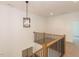 Upstairs hall with wood railing, chandelier and carpet at 103 Brandy Ml, Pittsboro, NC 27312