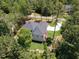 House nestled in wooded lot with large backyard and driveway at 103 Brandy Ml, Pittsboro, NC 27312