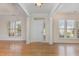 Bright and airy entryway with hardwood floors and ample natural light at 719 Allforth Pl, Cary, NC 27519