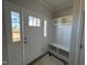 Open entryway with a white door and built-in storage at 95 Mapledale Ct, Benson, NC 27504