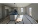 Modern kitchen with blue quartz countertops and stainless steel appliances at 95 Mapledale Ct, Benson, NC 27504