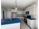 Modern kitchen with white cabinets and teal appliances at 95 Mapledale Ct, Benson, NC 27504