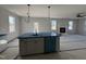 Spacious kitchen island, stainless steel dishwasher, and ample counter space at 95 Mapledale Ct, Benson, NC 27504