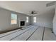 Bright living room with fireplace and ceiling fan at 95 Mapledale Ct, Benson, NC 27504
