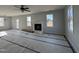 Open living room featuring a fireplace and ample natural light at 95 Mapledale Ct, Benson, NC 27504