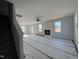 Spacious living room with a fireplace and large windows at 95 Mapledale Ct, Benson, NC 27504