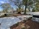 Large backyard with grassy area and concrete patio at 707 Richmond Ave, Burlington, NC 27217