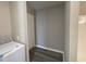 Laundry area with washer, dryer, and a door at 707 Richmond Ave, Burlington, NC 27217