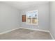 Cozy bedroom with carpet, window and corkboard at 369 Lowery Ln, Benson, NC 27504