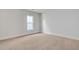 Bright bedroom with neutral walls and carpeted floor at 2892 Huxley Way, Apex, NC 27502