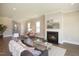 Spacious living room with hardwood floors, fireplace, and ample natural light at 2892 Huxley Way, Apex, NC 27502