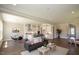 Open concept living room with hardwood floors and a cozy fireplace at 2892 Huxley Way, Apex, NC 27502
