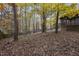 Wooded backyard with a view of the screened porch and deck at 1604 Green Pine Ct, Raleigh, NC 27614