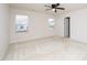 Well-lit bedroom with carpet, ceiling fan and two windows at 2117 Attend Xing, Fuquay Varina, NC 27526