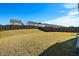Spacious backyard with a large grassy area and privacy fence at 2117 Attend Xing, Fuquay Varina, NC 27526