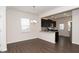 Modern kitchen with dark cabinetry, granite countertops, and a breakfast bar at 2117 Attend Xing, Fuquay Varina, NC 27526