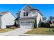 Two-story home with a two-car garage and manicured lawn at 2117 Attend Xing, Fuquay Varina, NC 27526