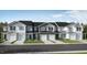 Exterior view of three townhouses with garages at 120 Parker Ln, Mebane, NC 27302