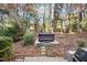 Hot tub nestled in a wooded backyard setting at 106 Springbrook Pl, Cary, NC 27518