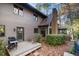 Elevated deck with grill, overlooks a partially wooded backyard at 106 Springbrook Pl, Cary, NC 27518