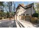Three-car garage with a long driveway at 106 Springbrook Pl, Cary, NC 27518