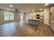 Open concept kitchen and living area with island at 132 S Mistflower St, Clayton, NC 27520