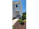 Front entrance of a two-story home with stone accents and landscaping at 1071 Cherry Stem Rd, Haw River, NC 27258
