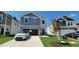 Two-story home with gray siding, stone accents, and a two-car garage at 1071 Cherry Stem Rd, Haw River, NC 27258