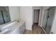Modern bathroom with double vanity, large mirror, and walk-in shower at 1071 Cherry Stem Rd, Haw River, NC 27258